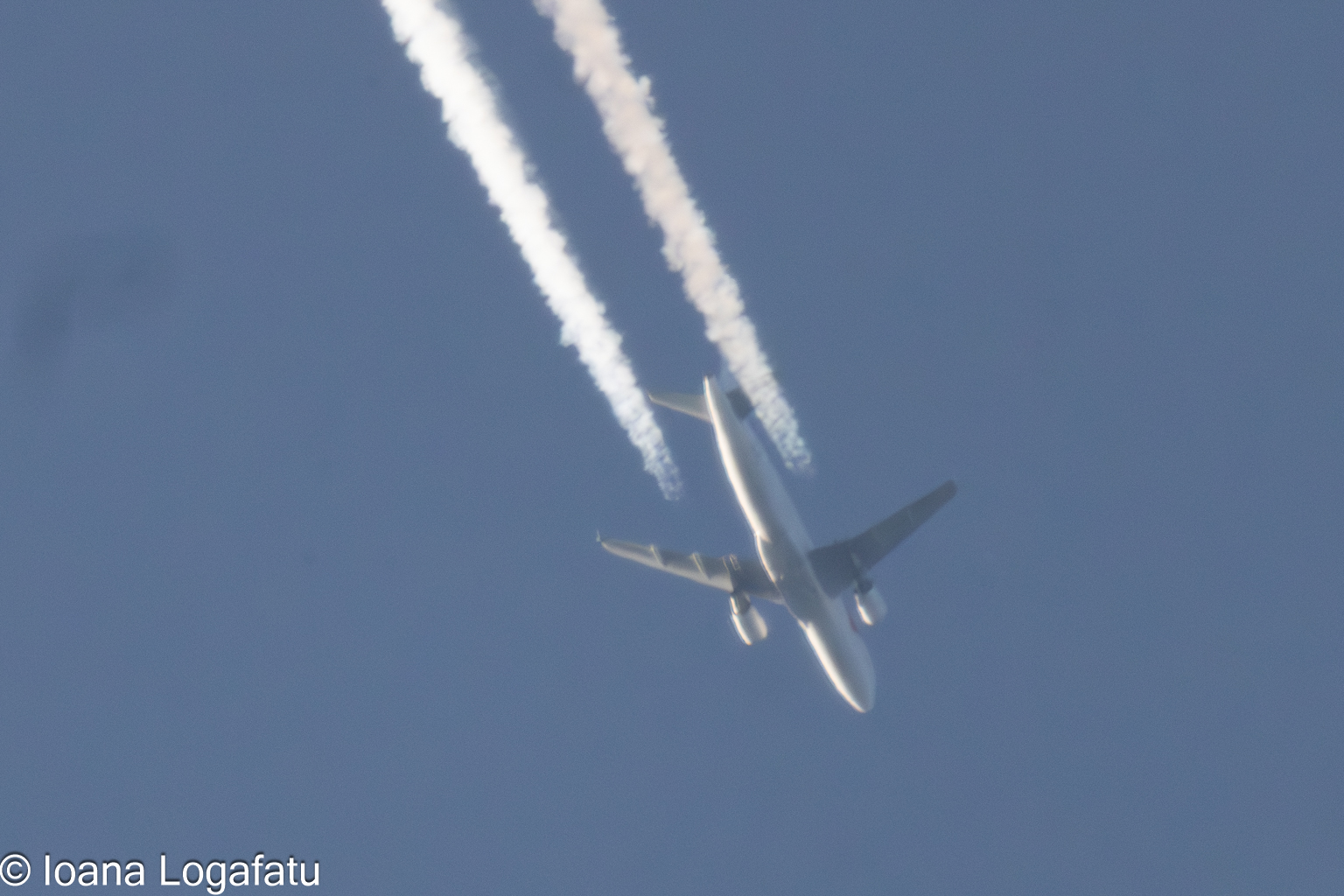Majestic airplane soaring across a clear sky